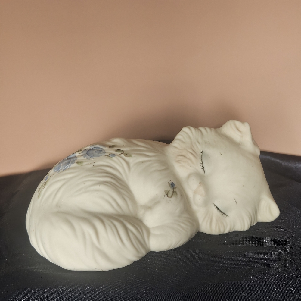 Vintage sleeping white cat with blue flower accents